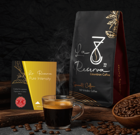 Premium Colombian specialty coffee Pure Intensity espresso by La Reserva 22, featuring a rich crema espresso, roasted coffee beans, product card, and elegant packaging on a wooden surface.